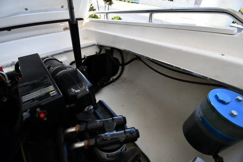 Slide: The Image of Engine compartment of a 1995 Fountain 24 Competition boat, showcasing mechanical components. - 27
