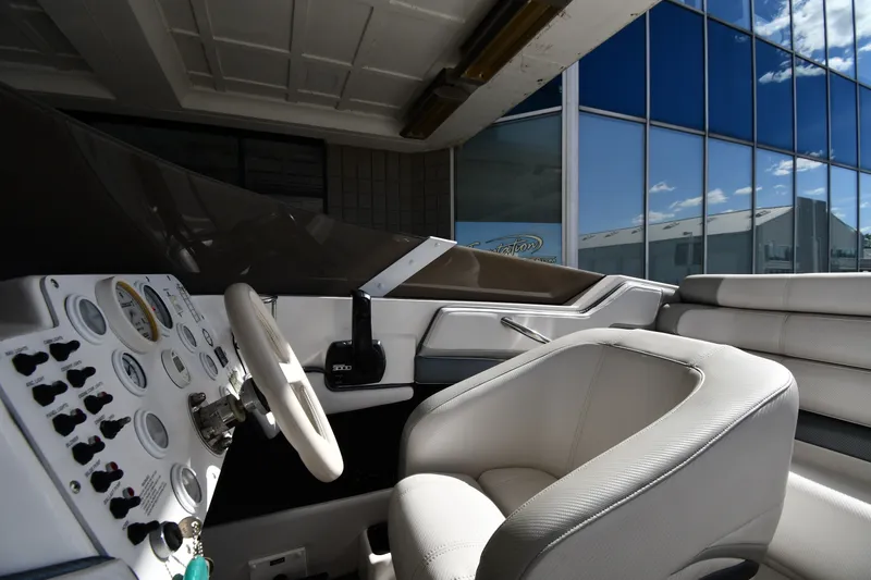 Slide: The Image of Interior of a 1995 Fountain 24 Competition boat, featuring steering wheel and control panel. - 17