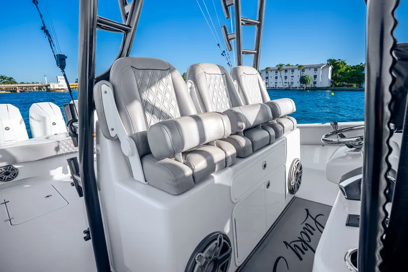 Slide: The Image of Luxurious seating on 2024 Conch 41 boat with scenic waterfront view. - 28