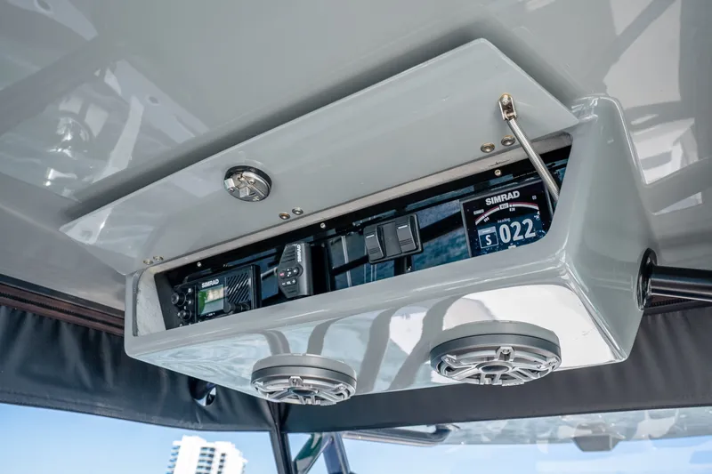 Slide: The Image of 2024 Conch 41 boat dashboard with Simrad electronics and speakers. - 27