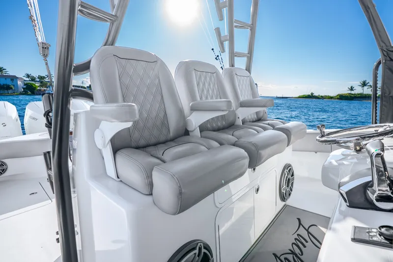 Slide: The Image of Luxurious seating on 2024 Conch 41 boat, featuring elegant design and ocean backdrop. - 29