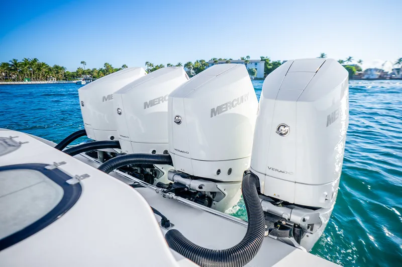 Slide: The Image of Four Mercury Verado outboard engines on a 2024 Conch 41 boat in clear blue water. - 18
