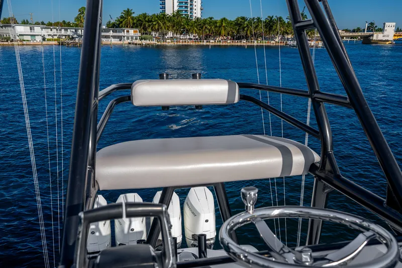 Slide: The Image of 2024 Conch 41 boat helm with ocean view and modern steering wheel. - 37