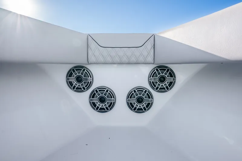 Slide: The Image of 2024 Conch 41 boat interior with four sleek speakers and quilted upholstery. - 44