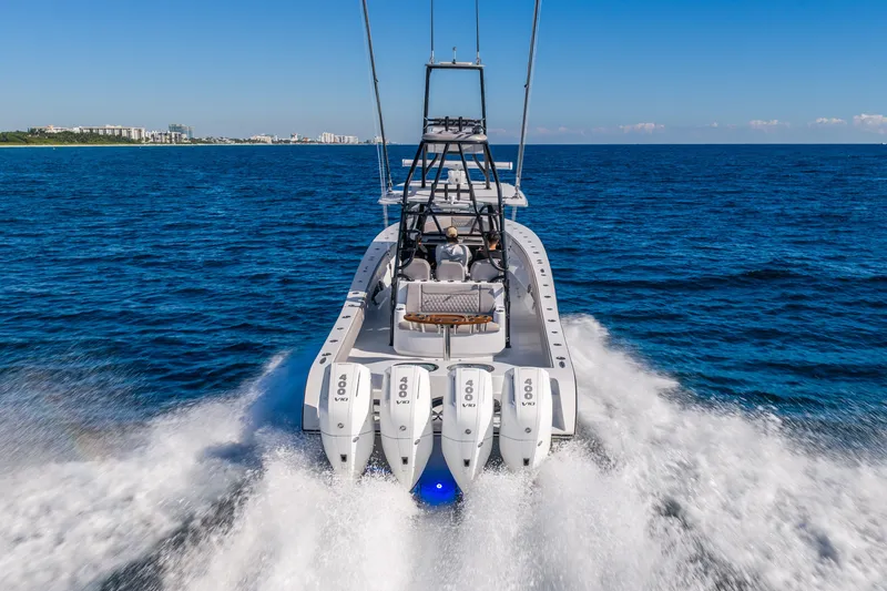 Slide: The Image of 2024 Conch 41 boat cruising on open ocean with powerful engines. - 13