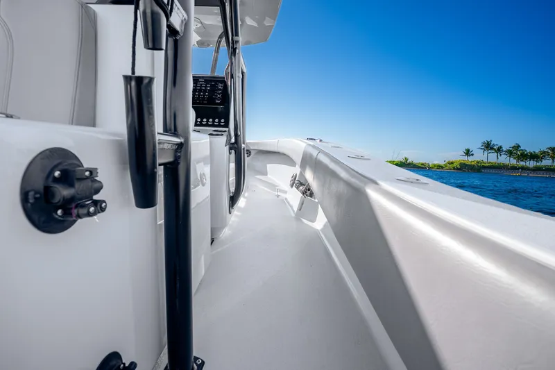 Slide: The Image of 2024 Conch 41 boat deck with sleek design, blue sky, and ocean view. - 32