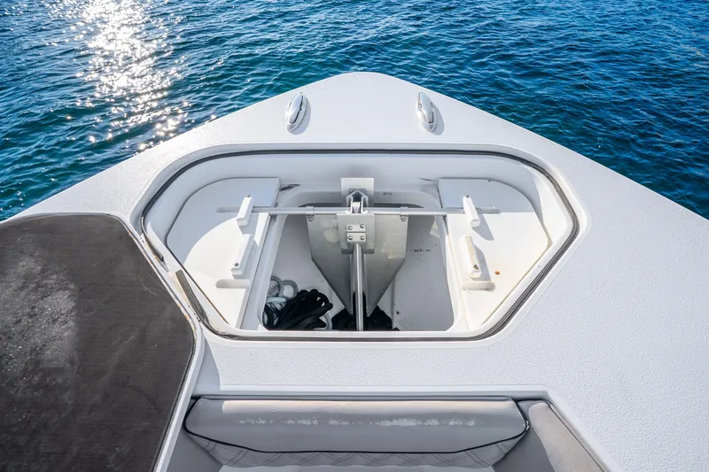 Slide: The Image of Anchor compartment of 2024 Conch 41 boat on blue water. - 46