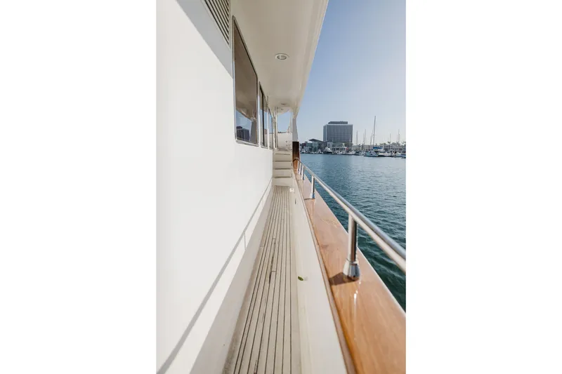 Slide: The Image of Side deck view of 1999 Ocean Alexander 680 Classicco yacht in marina. - 19
