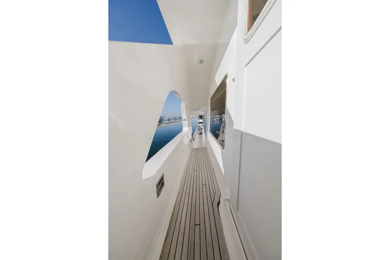 Slide: The Image of Side deck view of 1999 Ocean Alexander 680 Classicco yacht with ocean backdrop. - 17