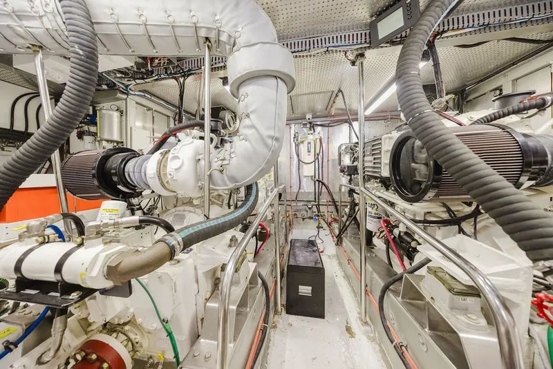 Slide: The Image of Engine room of 1999 Ocean Alexander 680 Classicco yacht, showcasing mechanical components and systems. - 80