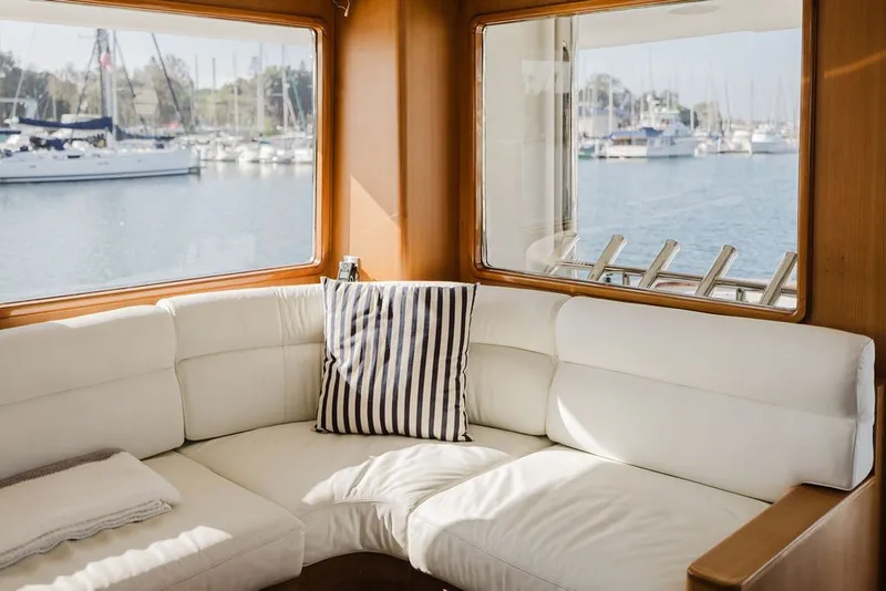 Slide: The Image of Luxurious interior of 1999 Ocean Alexander 680 Classicco yacht with marina view. - 25