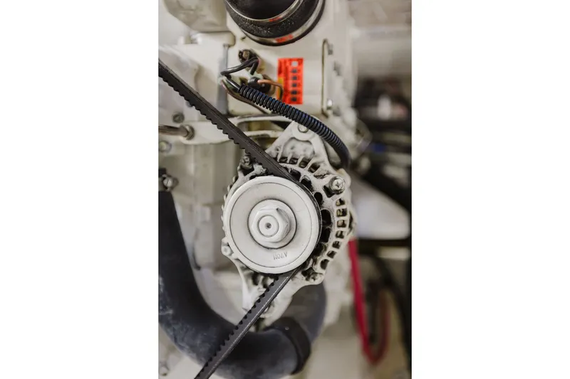 Slide: The Image of Close-up of 1999 Ocean Alexander 680 Classicco engine component with belt and wiring. - 100