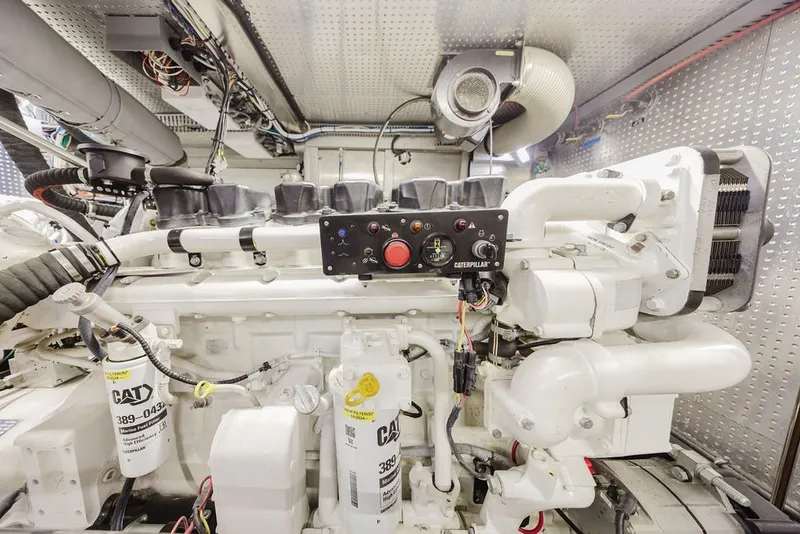 Slide: The Image of Engine room of 1999 Ocean Alexander 680 Classicco yacht, featuring Caterpillar machinery. - 82