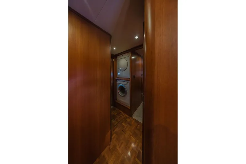 Slide: The Image of Laundry area in 1999 Ocean Alexander 680 Classicco yacht with wood paneling. - 76