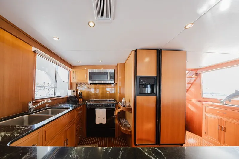 Slide: The Image of Luxurious kitchen interior of 1999 Ocean Alexander 680 Classicco yacht with modern appliances. - 32