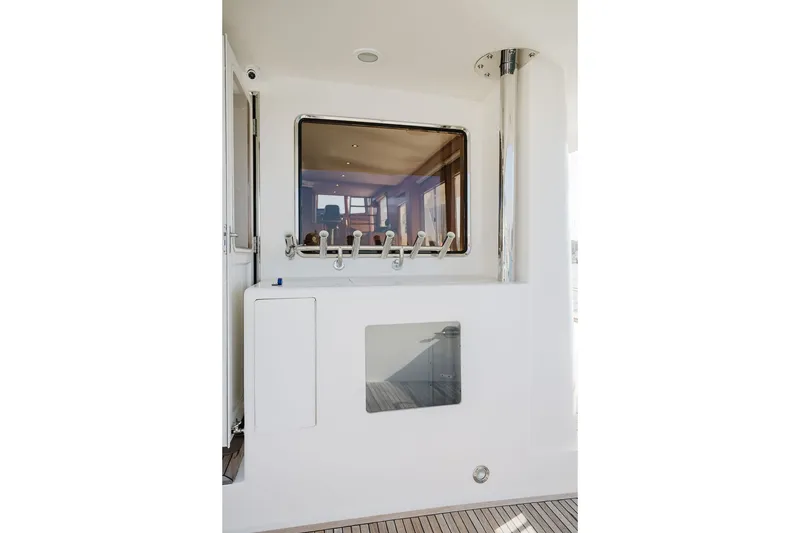 Slide: The Image of Ocean Alexander 680 Classicco 1999 yacht interior with window and sleek white design. - 21