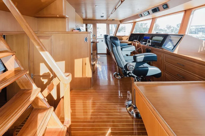 Slide: The Image of Luxurious interior of 1999 Ocean Alexander 680 Classicco yacht with polished wood and modern helm. - 47