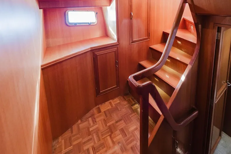 Slide: The Image of Interior of 1999 Ocean Alexander 680 Classicco yacht with wooden stairs and cabinetry. - 74