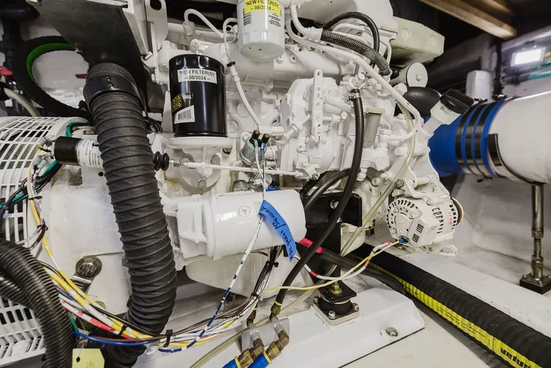 Slide: The Image of Engine compartment of a 1999 Ocean Alexander 680 Classicco yacht, showcasing detailed machinery. - 110