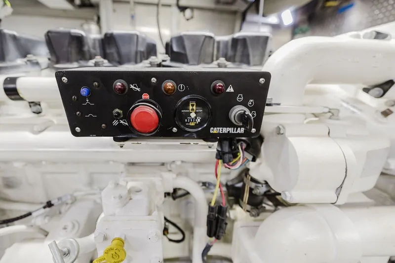 Slide: The Image of Engine control panel of a 1999 Ocean Alexander 680 Classicco yacht, featuring Caterpillar components. - 81