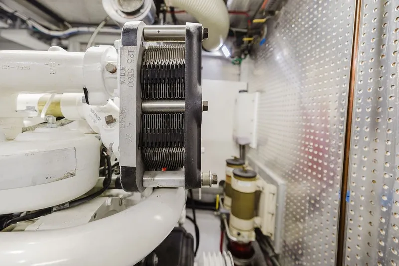 Slide: The Image of Engine room of 1999 Ocean Alexander 680 Classicco yacht, showcasing mechanical components. - 92