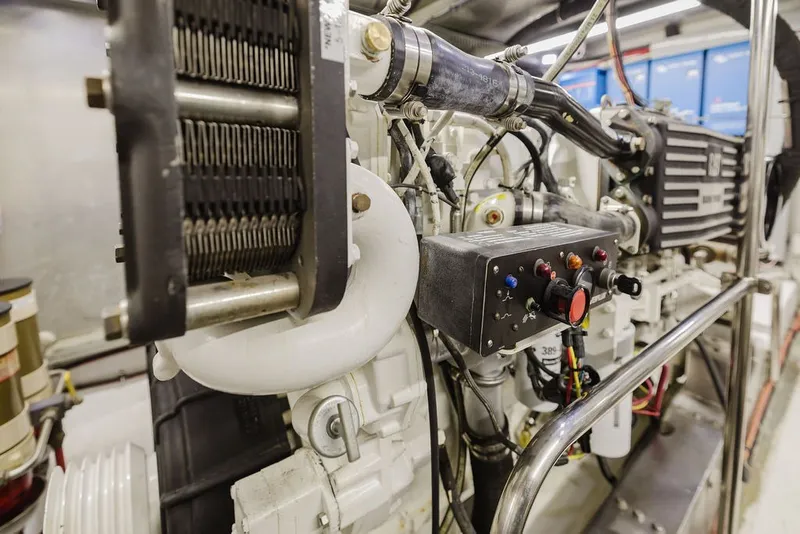 Slide: The Image of Engine room of 1999 Ocean Alexander 680 Classicco yacht, showcasing mechanical components. - 90