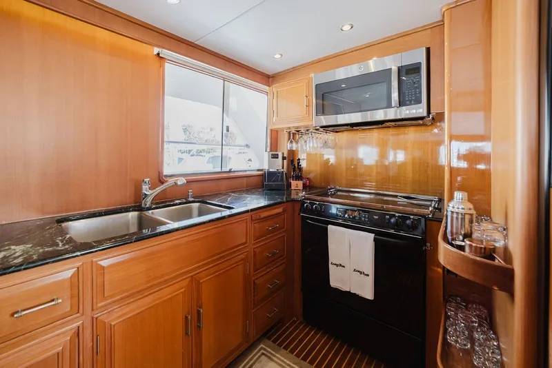 Slide: The Image of Luxurious kitchen interior of 1999 Ocean Alexander 680 Classicco yacht with modern appliances. - 33