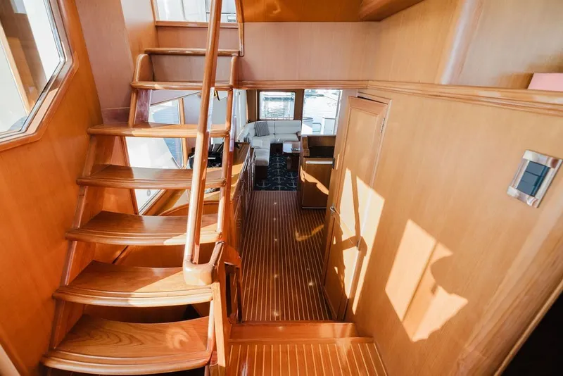 Slide: The Image of Interior of 1999 Ocean Alexander 680 Classicco yacht with wooden staircase and elegant design. - 38