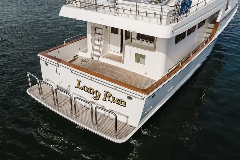 Slide: The Image of 1999 Ocean Alexander 680 Classicco yacht named "Long Run" on water. - 116