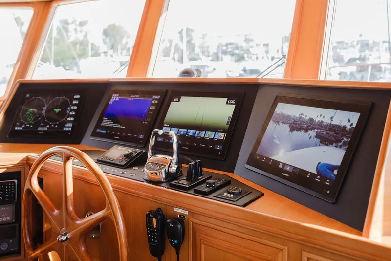 Slide: The Image of Control panel of 1999 Ocean Alexander 680 Classicco yacht with navigation screens and steering wheel. - 41