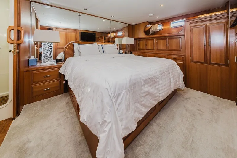 Slide: The Image of Luxurious bedroom interior of 1999 Ocean Alexander 680 Classicco yacht with elegant wood finishes. - 57