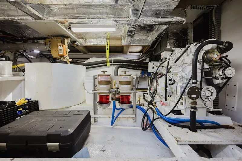 Slide: The Image of Engine room of 1999 Ocean Alexander 680 Classicco yacht, showcasing mechanical components and equipment. - 107