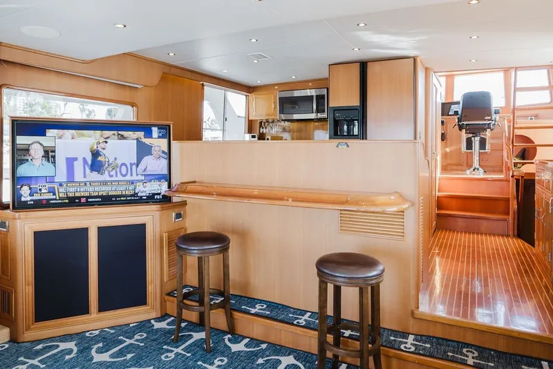 Slide: The Image of Luxurious interior of 1999 Ocean Alexander 680 Classicco yacht with bar and entertainment area. - 29