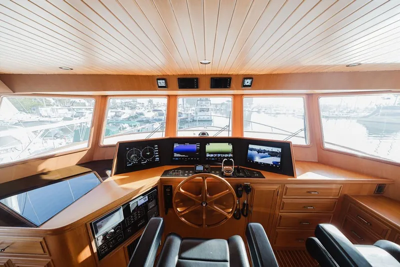 Slide: The Image of Pilothouse of 1999 Ocean Alexander 680 Classicco yacht with navigation equipment and wooden interior. - 39