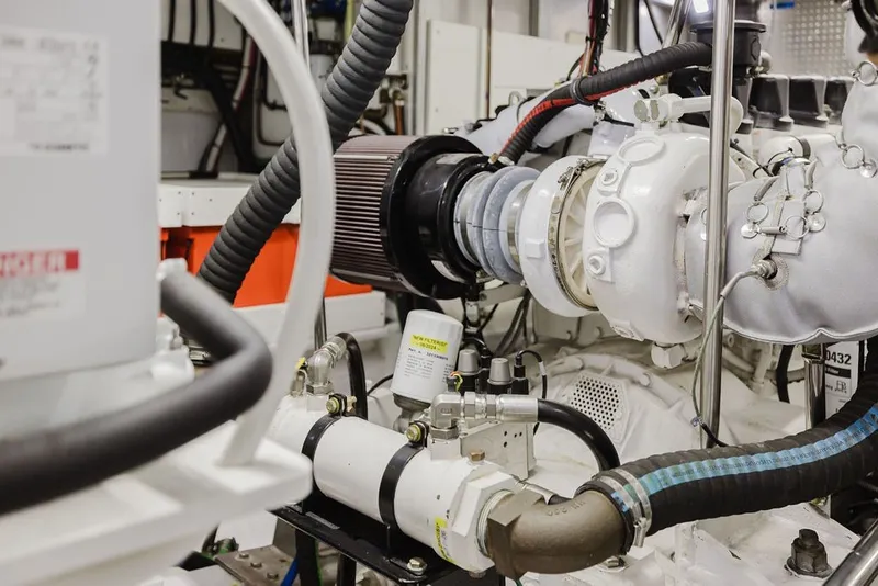 Slide: The Image of Engine room of 1999 Ocean Alexander 680 Classicco yacht, showcasing mechanical components. - 83