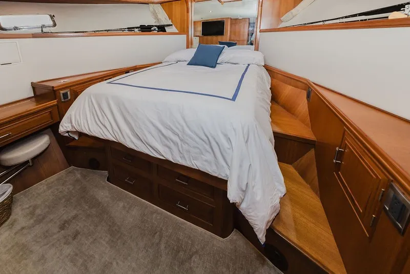 Slide: The Image of Luxurious bedroom interior of 1999 Ocean Alexander 680 Classicco yacht with wooden cabinetry. - 64