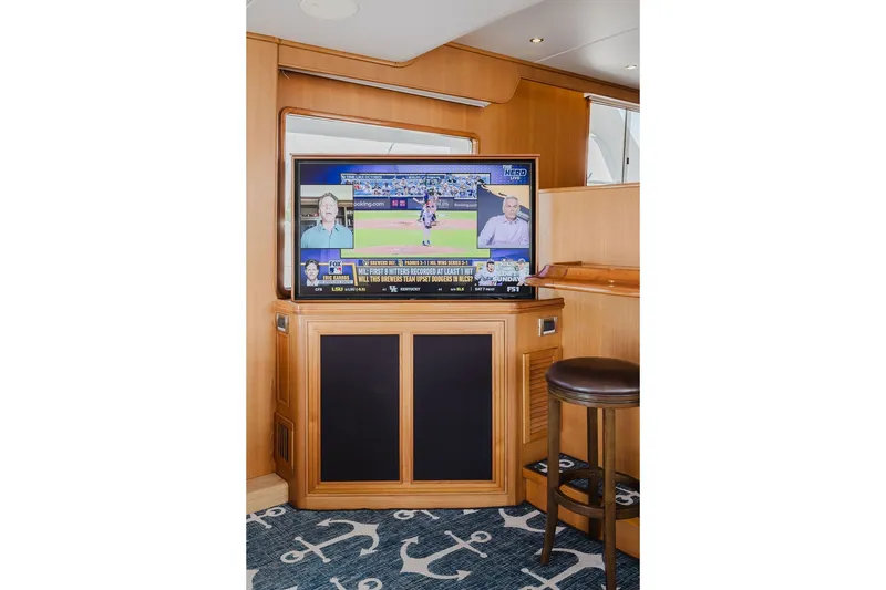 Slide: The Image of Entertainment area on 1999 Ocean Alexander 680 Classicco yacht with TV and bar stool. - 30