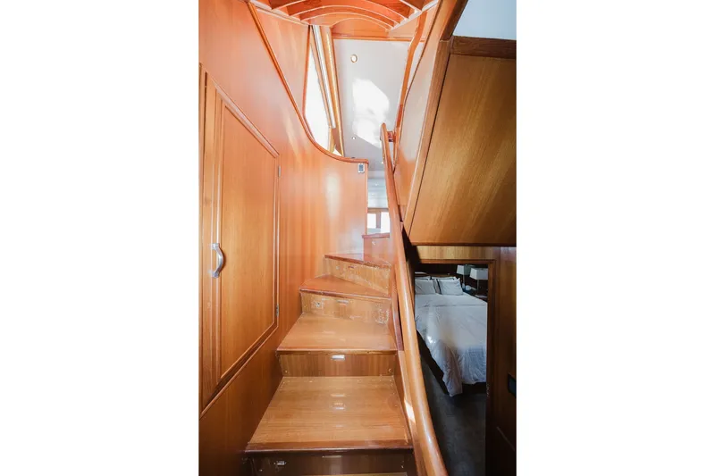 Slide: The Image of Wooden staircase inside 1999 Ocean Alexander 680 Classicco yacht, leading to upper deck. - 75