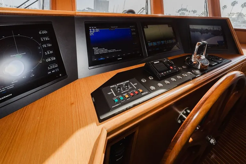 Slide: The Image of 1999 Ocean Alexander 680 Classicco yacht helm with navigation screens and controls. - 42