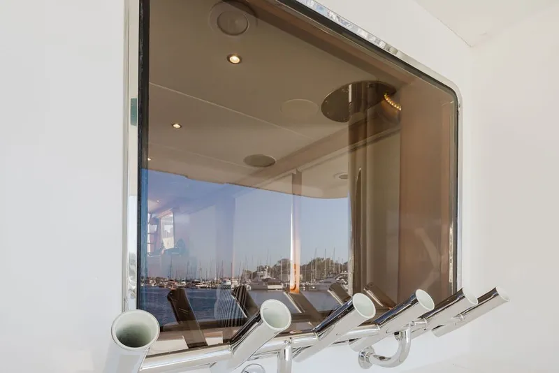 Slide: The Image of Window view from 1999 Ocean Alexander 680 Classicco yacht, showcasing marina and interior reflections. - 20