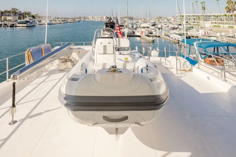 Slide: The Image of 1999 Ocean Alexander 680 Classicco yacht with tender, docked in a marina. - 13