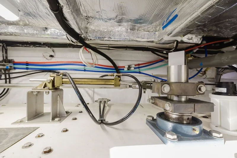 Slide: The Image of Engine room of 1999 Ocean Alexander 680 Classicco yacht, showcasing mechanical components and wiring. - 105