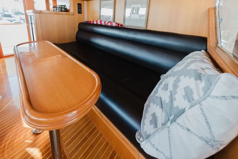 Slide: The Image of Luxurious interior of 1999 Ocean Alexander 680 Classicco yacht with black leather seating. - 51