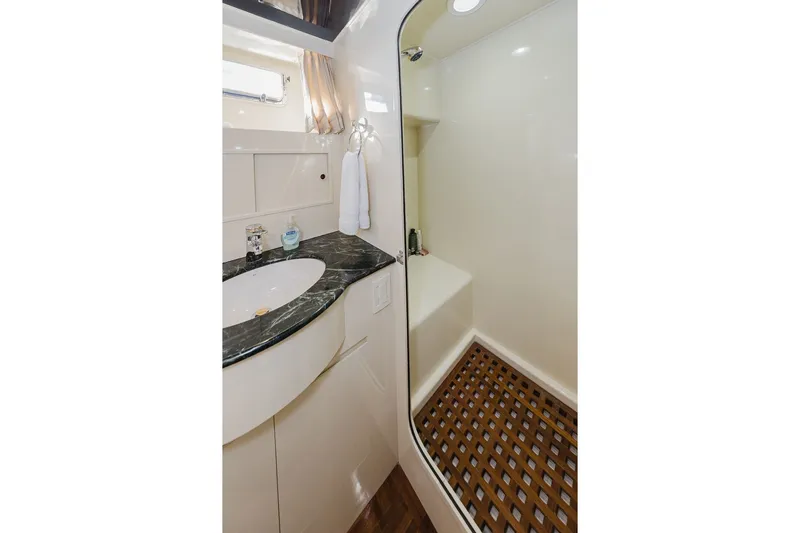 Slide: The Image of Luxurious bathroom in 1999 Ocean Alexander 680 Classicco yacht with marble countertop and shower. - 62
