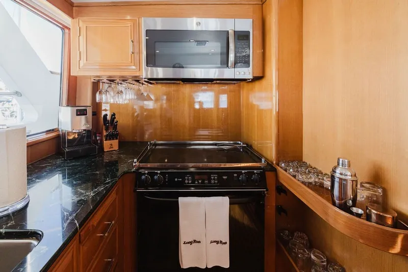 Slide: The Image of Galley kitchen in 1999 Ocean Alexander 680 Classicco yacht with modern appliances. - 34