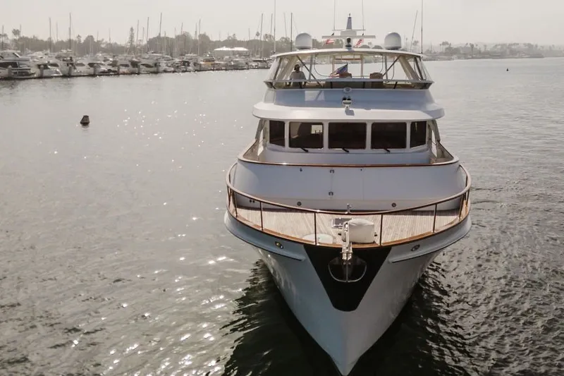 Slide: The Image of 1999 Ocean Alexander 680 Classicco yacht docked in a serene marina setting. - 119