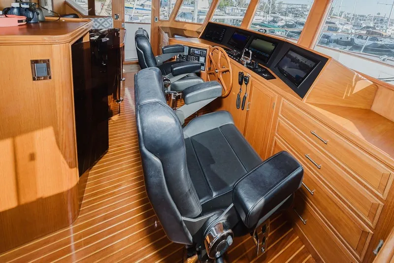 Slide: The Image of Luxurious helm of 1999 Ocean Alexander 680 Classicco yacht with leather seats and wooden finish. - 49