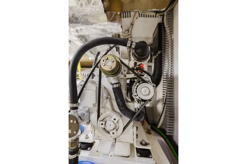 Slide: The Image of Engine compartment of 1999 Ocean Alexander 680 Classicco yacht, showcasing mechanical components. - 99