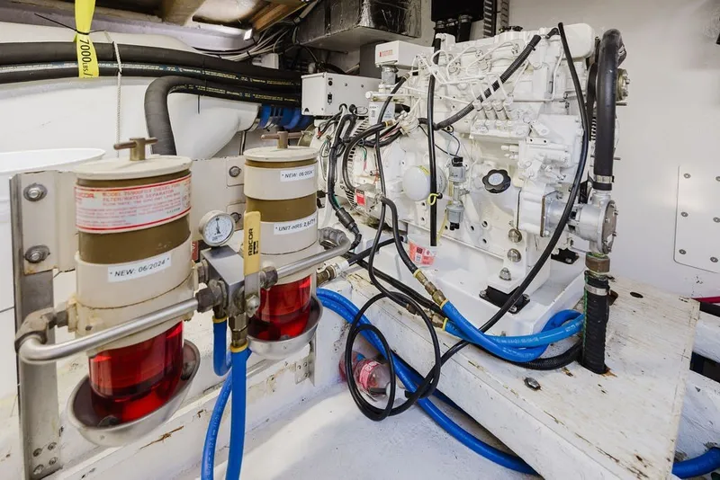 Slide: The Image of Engine room of 1999 Ocean Alexander 680 Classicco yacht with fuel filters and hoses. - 108