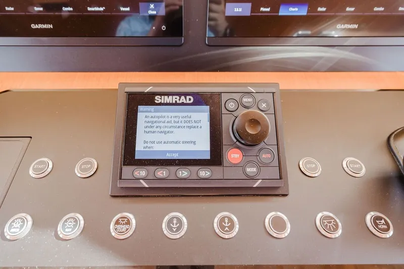 Slide: The Image of Simrad autopilot control panel on 1999 Ocean Alexander 680 Classicco yacht dashboard. - 44